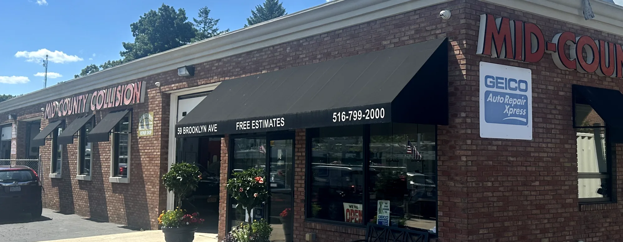 Mid-County Collision auto body shop storefront at 59 Brooklyn Ave in Massapequa NY